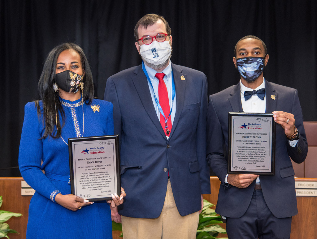Image of Board President, Eric Dick, with two newly sworn in board members.